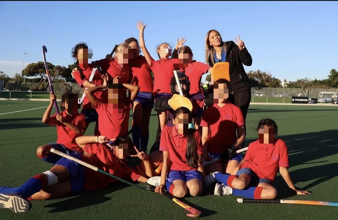 Kaylee with her U9 and U12 girls' hockey team